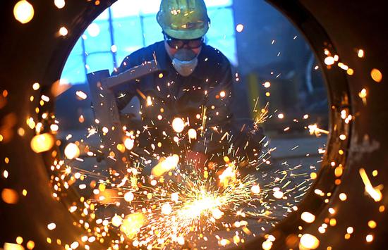 China's industrial output growth accelerates amid economic 